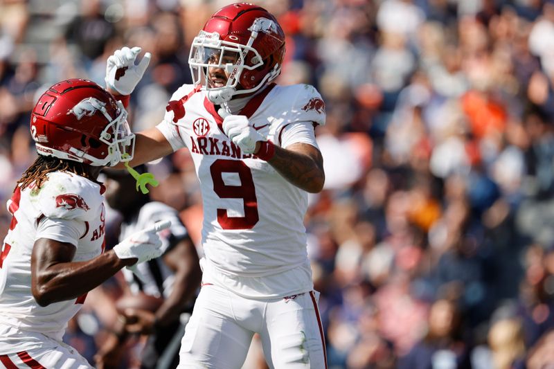 Oct 29, 2022; Auburn, Alabama, USA;  Arkansas Razorbacks wide receiver Jadon Haselwood (9) celebrates scoring a touchdown with wide receiver Ketron Jackson Jr. (2) during the third quarter against the Auburn Tigers at Jordan-Hare Stadium.  Mandatory Credit: John Reed-USA TODAY Sports