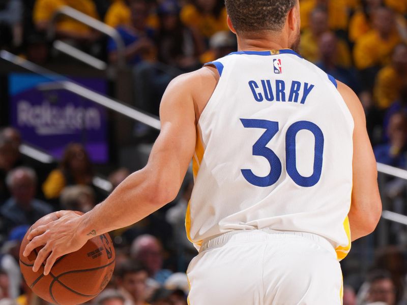 SAN FRANCISCO, CA - APRIL 26:   Stephen Curry #30 of the Golden State Warriors dribbles the ball during the game against the Houston Rockets during Round 1 Game 3 of the 2025 NBA Playoffs   on April 26, 2025 at Chase Center in San Francisco, California. NOTE TO USER: User expressly acknowledges and agrees that, by downloading and or using this photograph, user is consenting to the terms and conditions of Getty Images License Agreement. Mandatory Copyright Notice: Copyright 2025 NBAE (Photo by Jesse D. Garrabrant/NBAE via Getty Images)