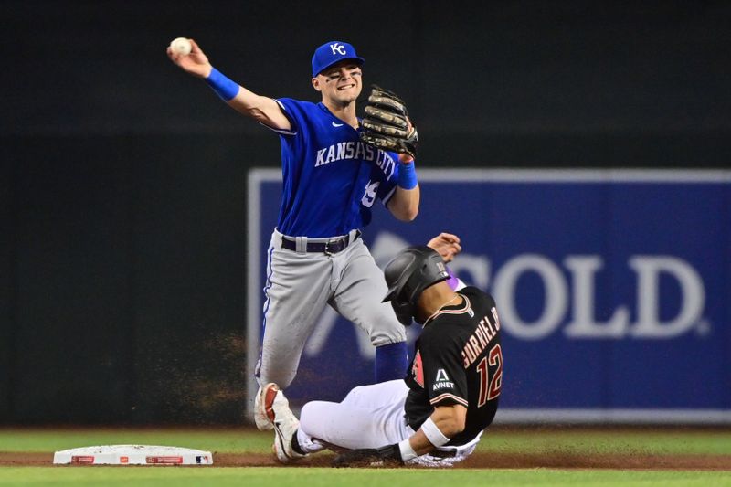 Apr 26, 2023; Phoenix, Arizona, USA; Arizona Diamondbacks left fielder Lourdes Gurriel Jr. (12) is out as Kansas City Royals second baseman Michael Massey (19) throws to first base in the fourth inning at Chase Field. Mandatory Credit: Matt Kartozian-USA TODAY Sports