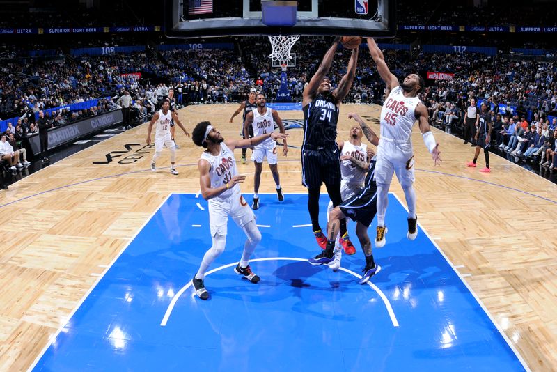 ORLANDO, FL - FEBRUARY 25:  Wendell Carter Jr. #34 of the Orlando Magic goes up for the rebound during the game against the Cleveland Cavaliers on February 25, 2025 at Kia Center in Orlando, Florida. NOTE TO USER: User expressly acknowledges and agrees that, by downloading and or using this photograph, User is consenting to the terms and conditions of the Getty Images License Agreement. Mandatory Copyright Notice: Copyright 2025 NBAE (Photo by Fernando Medina/NBAE via Getty Images)