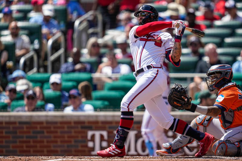 Apr 23, 2023; Cumberland, Georgia, USA; Atlanta Braves left fielder Kevin Pillar (17) hits a home run against the Houston Astros during the fifth inning at Truist Park. Mandatory Credit: Dale Zanine-USA TODAY Sports