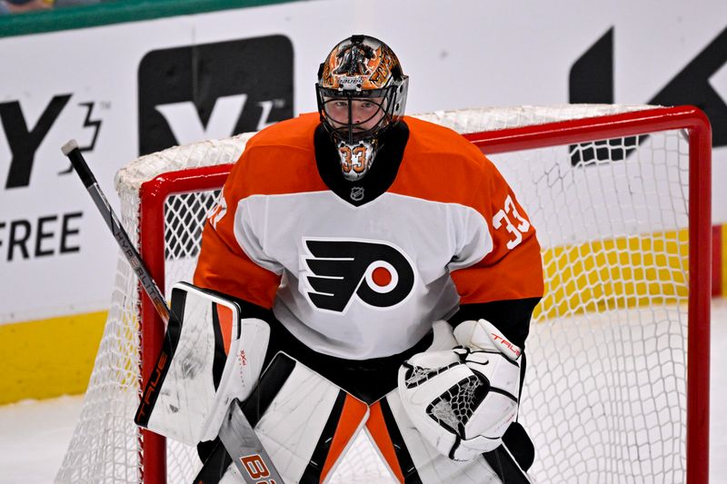 Mar 22, 2025; Dallas, Texas, USA; Philadelphia Flyers goaltender Samuel Ersson (33) faces the Dallas Stars attack during the third period at the American Airlines Center. Mandatory Credit: Jerome Miron-Imagn Images