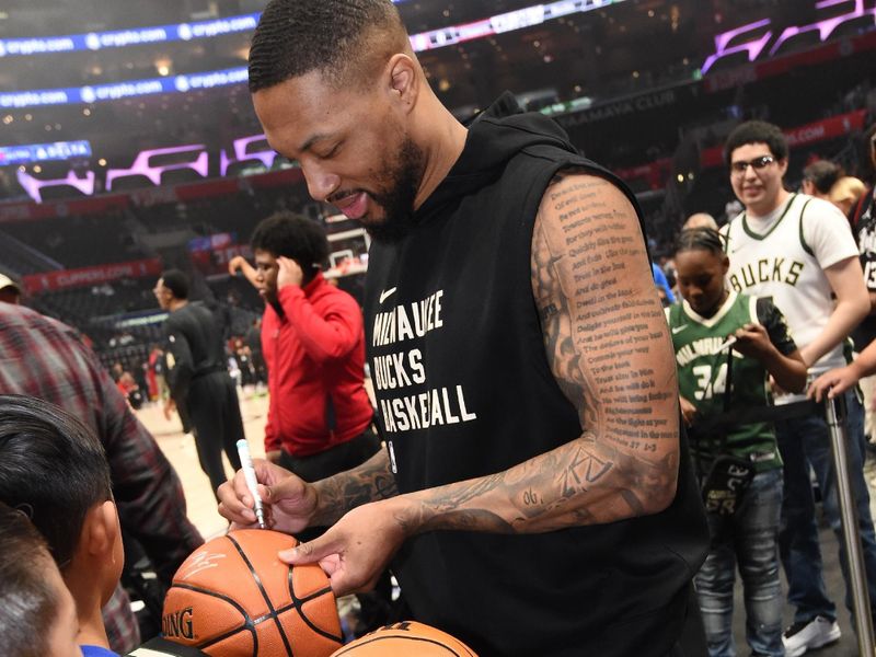 LOS ANGELES, CA - MARCH 10: Damian Lillard #0 of the Milwaukee Bucks signs autographs before the game against the LA Clippers on March 10, 2024 at Crypto.Com Arena in Los Angeles, California. NOTE TO USER: User expressly acknowledges and agrees that, by downloading and/or using this Photograph, user is consenting to the terms and conditions of the Getty Images License Agreement. Mandatory Copyright Notice: Copyright 2024 NBAE (Photo by Andrew D. Bernstein/NBAE via Getty Images)