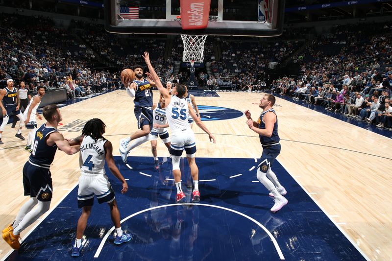 MINNEAPOLIS, MN -  OCTOBER 17: Jamal Murray #27 of the Denver Nuggets drives to the basket during the game against the Minnesota Timberwolves during the 2024 NBA Preseason on October 17, 2024 at Target Center in Minneapolis, Minnesota. NOTE TO USER: User expressly acknowledges and agrees that, by downloading and or using this Photograph, user is consenting to the terms and conditions of the Getty Images License Agreement. Mandatory Copyright Notice: Copyright 2024 NBAE (Photo by David Sherman/NBAE via Getty Images)