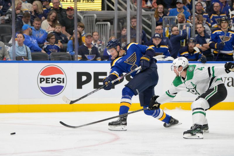 Oct 18, 2025; St. Louis, Missouri, USA; Dallas Stars defenseman Miro Heiskanen (4) attempts to block a shock from St. Louis Blues defenseman Cam Fowler (17) during the second period at Enterprise Center. Mandatory Credit: Jeff Le-Imagn Images