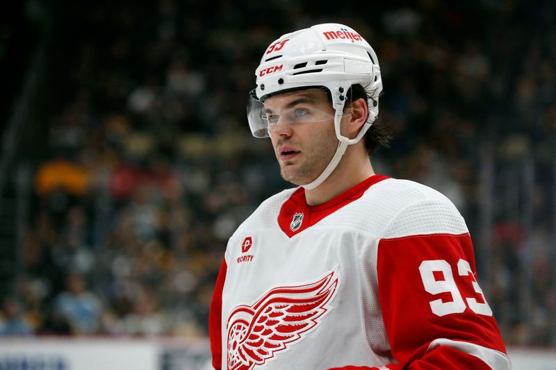 Apr 11, 2024; Pittsburgh, Pennsylvania, USA; Detroit Red Wings right wing Alex DeBrincat (93) looks on against the Pittsburgh Penguins during the second period at PPG Paints Arena. Pittsburgh won 6-5 in overtime. Mandatory Credit: Charles LeClaire-USA TODAY Sports