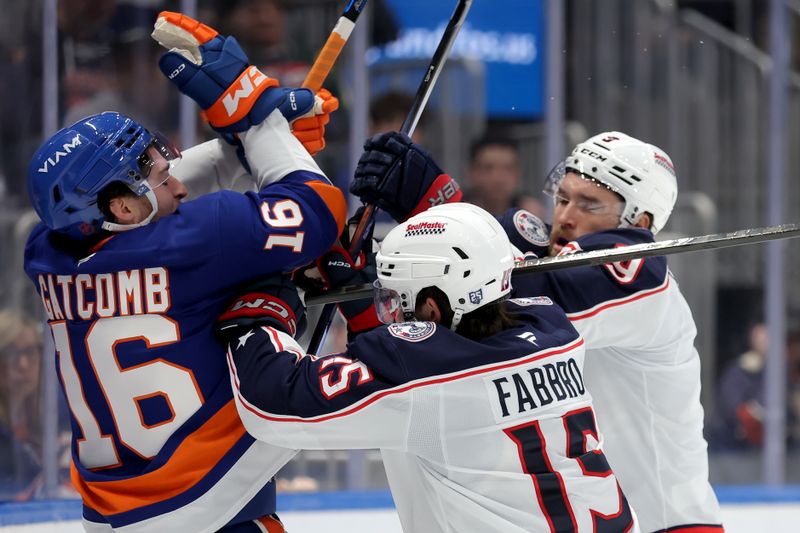 Mar 22, 2026; Elmont, New York, USA; New York Islanders center Marc Gatcomb (16) is shoved by Columbus Blue Jackets defensemen Dante Fabbro (15) and Ivan Provorov (9) during the second period at UBS Arena. Mandatory Credit: Brad Penner-Imagn Images Mar 22, 2026; Elmont, New York, USA; New York Islanders center Marc Gatcomb (16) is shoved by Columbus Blue Jackets defensemen Dante Fabbro (15) and Ivan Provorov (9) during the second period at UBS Arena. Mandatory Credit: Brad Penner-Imagn Images