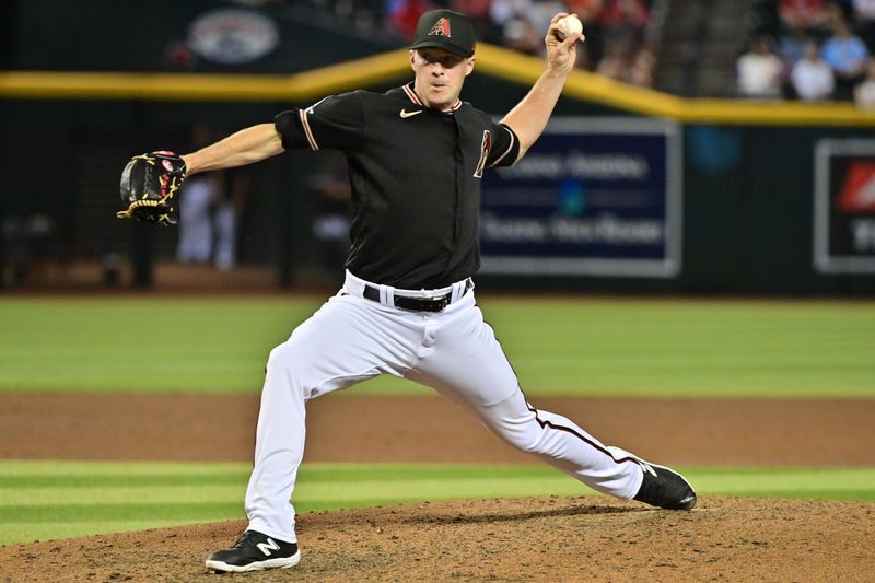 May 8, 2023; Phoenix, Arizona, USA;  Arizona Diamondbacks relief pitcher Joe Mantiply (35) throws in the ninth inning against the Miami Marlins at Chase Field. Mandatory Credit: Matt Kartozian-USA TODAY Sports