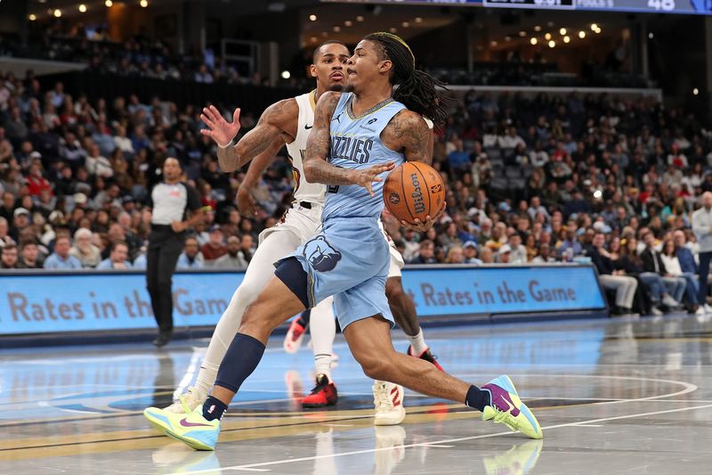 MEMPHIS, TENNESSEE - NOVEMBER 29: Ja Morant #12 of the Memphis Grizzlies goes to the basket against Dejounte Murray #5 of the New Orleans Pelicans during the first half of an Emirates NBA Cup game at FedExForum on November 29, 2024 in Memphis, Tennessee. NOTE TO USER: User expressly acknowledges and agrees that, by downloading and or using this photograph, User is consenting to the terms and conditions of the Getty Images License Agreement. (Photo by Justin Ford/Getty Images)