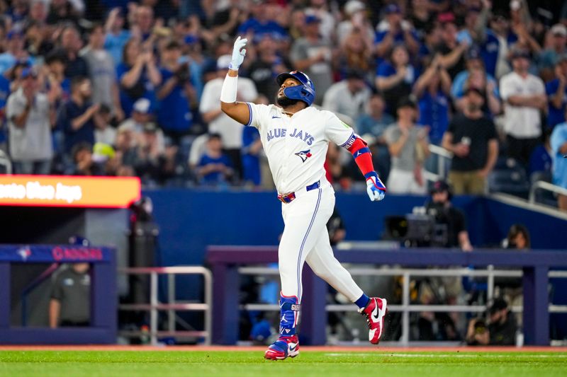 Jun 29, 2024; Toronto, Ontario, CAN; Toronto Blue Jays first base Vladimir Guerrero Jr. (27) celebrates after hitting a home run against the New York Yankees during the first inning at Rogers Centre. Mandatory Credit: Kevin Sousa-USA TODAY Sports