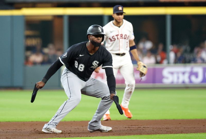 Jun 10, 2025; Houston, Texas, USA;  Chicago White Sox center fielder Luis Robert Jr. (88) reacts to his stand up double RBI against the Houston Astros in the first inning at Daikin Park. Mandatory Credit: Thomas Shea-Imagn Images