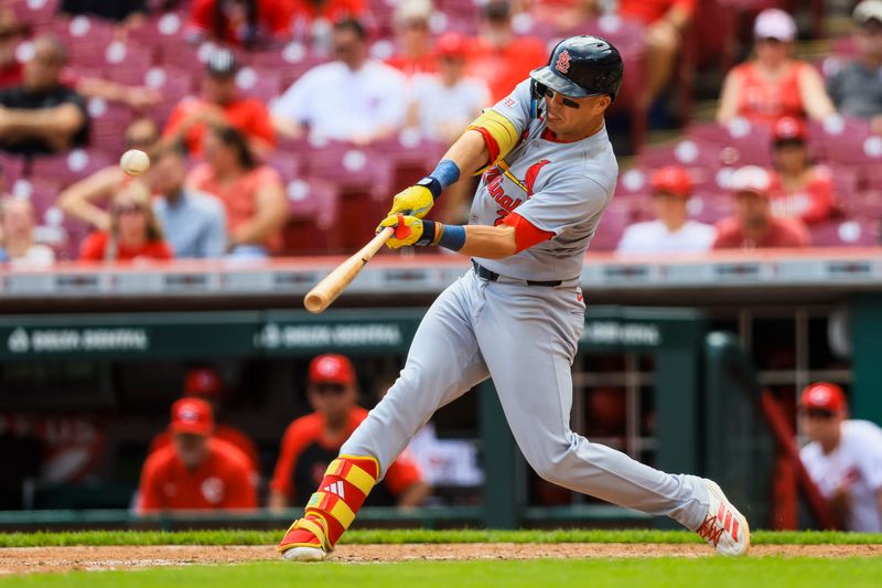 Apr 30, 2025; Cincinnati, Ohio, USA; St. Louis Cardinals outfielder Lars Nootbaar (21) hits a solo home run in the ninth inning against the Cincinnati Reds at Great American Ball Park. Mandatory Credit: Katie Stratman-Imagn Images
