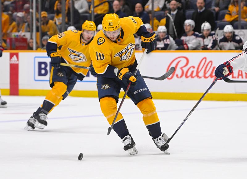 Jan 17, 2023; Nashville, Tennessee, USA;  Nashville Predators center Colton Sissons (10) skates against the Columbus Blue Jackets during the first period at Bridgestone Arena. Mandatory Credit: Steve Roberts-USA TODAY Sports