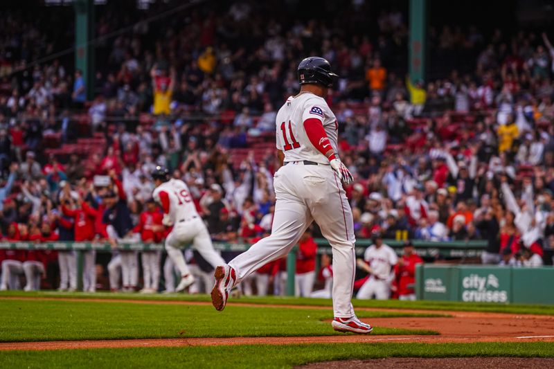 Jun 10, 2025; Boston, Massachusetts, USA; Boston Red Sox odesignated hitter Rafael Devers (11) scores as utfielder Roman Anthony (19) hits a double to drive in two runs against the Tampa Bay Rays in the first inning at Fenway Park. Mandatory Credit: David Butler II-Imagn Images