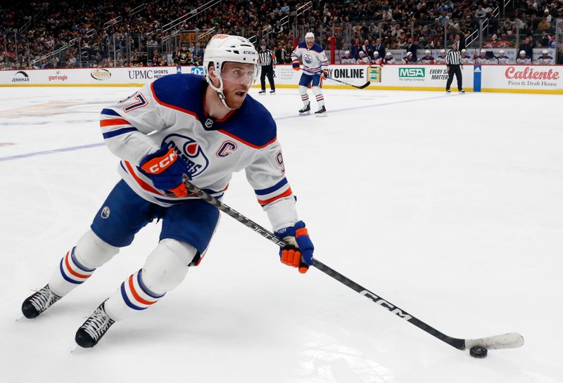 Mar 10, 2024; Pittsburgh, Pennsylvania, USA;  Edmonton Oilers center Connor McDavid (97) skates with the puck against the Pittsburgh Penguins during the second period at PPG Paints Arena. The Oilers won 4-0. Mandatory Credit: Charles LeClaire-USA TODAY Sports