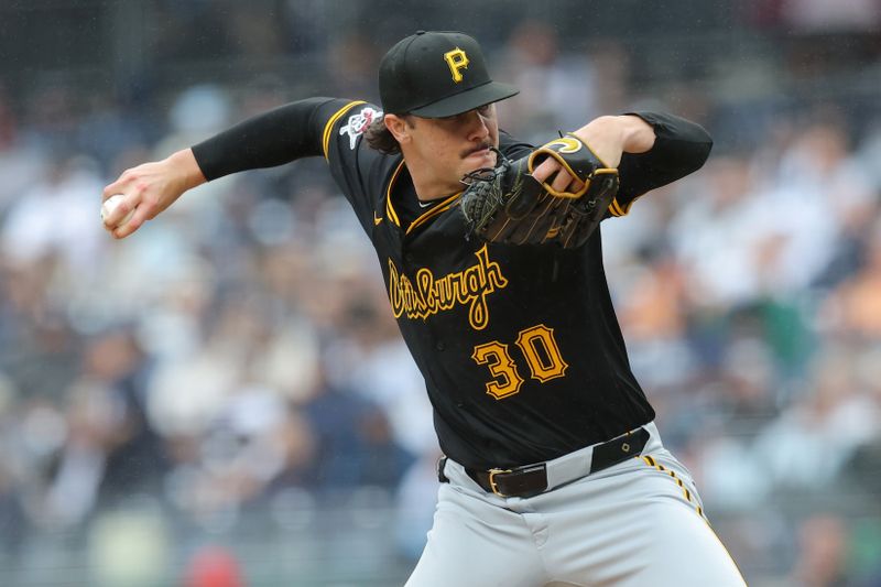 Sep 28, 2024; Bronx, New York, USA; Pittsburgh Pirates starting pitcher Paul Skenes (30) pitches against the New York Yankees during the first inning at Yankee Stadium. Mandatory Credit: Brad Penner-Imagn Images