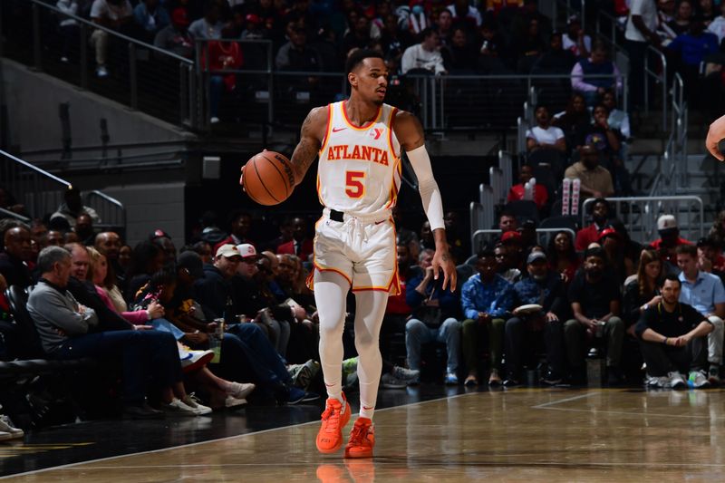 ATLANTA, GA - MARCH 23: Dejounte Murray #5 of the Atlanta Hawks dribbles the ball during the game against the Charlotte Hornets on March 23, 2024 at State Farm Arena in Atlanta, Georgia.  NOTE TO USER: User expressly acknowledges and agrees that, by downloading and/or using this Photograph, user is consenting to the terms and conditions of the Getty Images License Agreement. Mandatory Copyright Notice: Copyright 2024 NBAE (Photo by Scott Cunningham/NBAE via Getty Images)