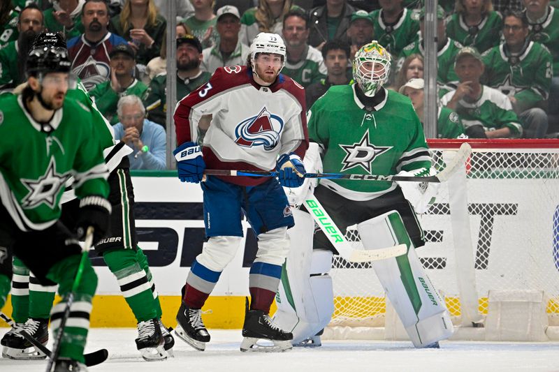 May 7, 2024; Dallas, Texas, USA; Colorado Avalanche center Yakov Trenin (73) looks for the puck in front of Dallas Stars goaltender Jake Oettinger (29) during the second period in game one of the second round of the 2024 Stanley Cup Playoffs at American Airlines Center. Mandatory Credit: Jerome Miron-USA TODAY Sports