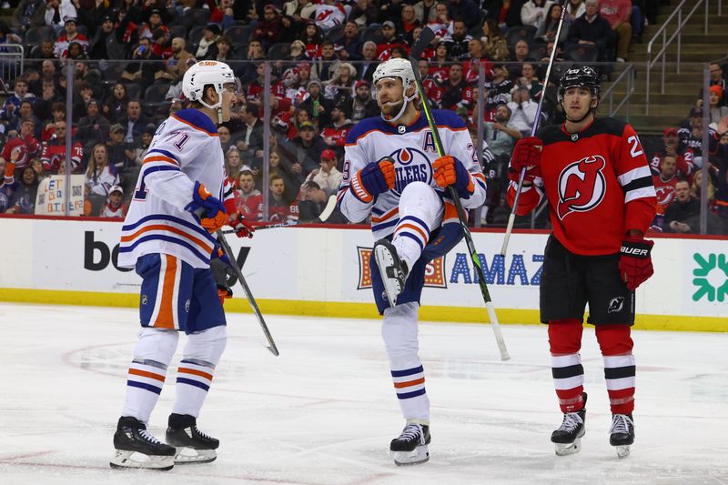 Dec 21, 2023; Newark, New Jersey, USA; Edmonton Oilers center Leon Draisaitl (29) celebrates his goal against the New Jersey Devils during the third period at Prudential Center. Mandatory Credit: Ed Mulholland-USA TODAY Sports