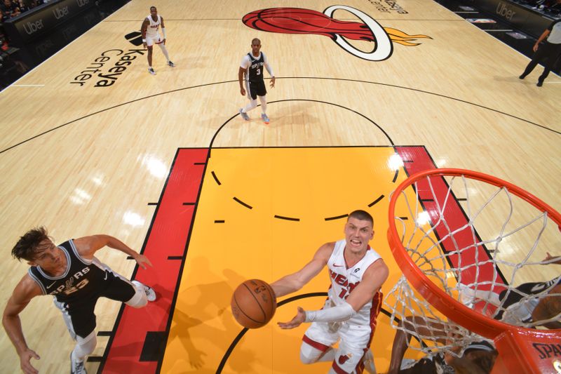 MIAMI, FL - OCTOBER 15: Tyler Herro #14 of the Miami Heat drives to the basket during the game against the San Antonio Spurs during a NBA preseason game on October 15, 2024 at Kaseya Center in Miami, Florida. NOTE TO USER: User expressly acknowledges and agrees that, by downloading and or using this Photograph, user is consenting to the terms and conditions of the Getty Images License Agreement. Mandatory Copyright Notice: Copyright 2024 NBAE (Photo by Jesse D. Garrabrant/NBAE via Getty Images)