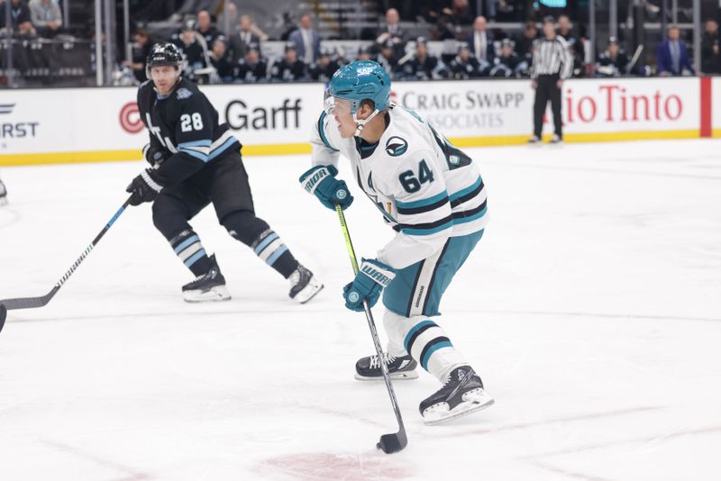 Oct 28, 2024; Salt Lake City, Utah, USA;  San Jose Sharks center Mikael Granlund (64) controls the puck against the Utah Hockey Club at Delta Center. Mandatory Credit: Chris Nicoll-Imagn Images