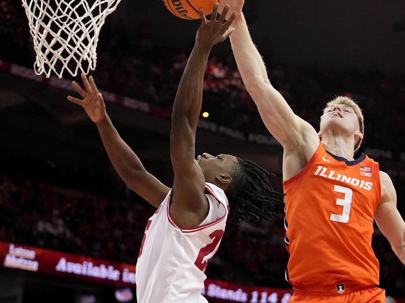 Mar 2, 2024; Madison, WI, USA;  Illinois forward Marcus Domask (3) blocks a shot by Wisconsin guard John Blackwell (25) during the second half of their game Saturday, March 2, 2024 at the Kohl Center in Madison, Wisconsin.  Mandatory Credit: Mark Hoffman-USA TODAY Sports
