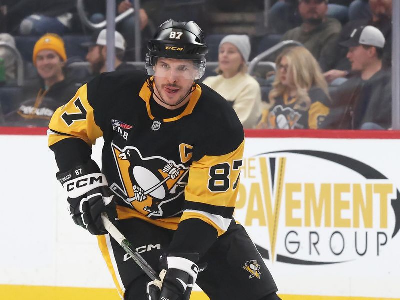 Dec 14, 2025; Pittsburgh, Pennsylvania, USA;  Pittsburgh Penguins center Sidney Crosby (87) skates up ice with the puck against the Utah Mammoth during the first period at PPG Paints Arena. Mandatory Credit: Charles LeClaire-Imagn Images