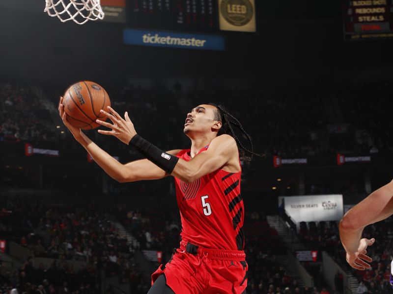 PORTLAND, OR - NOVEMBER 29: Dalano Banton #5 of the Portland Trail Blazers drives to the basket during the game against the Sacramento Kings during the Emirates NBA Cup on November 29, 2024 at the Moda Center Arena in Portland, Oregon. NOTE TO USER: User expressly acknowledges and agrees that, by downloading and or using this photograph, user is consenting to the terms and conditions of the Getty Images License Agreement. Mandatory Copyright Notice: Copyright 2024 NBAE (Photo by Cameron Browne/NBAE via Getty Images)