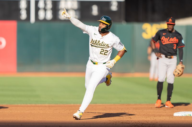 Jul 5, 2024; Oakland, California, USA;  Oakland Athletics outfielder Miguel Andujar (22) reacts after hitting a solo home run during the first inning against the Baltimore Orioles at Oakland-Alameda County Coliseum. Mandatory Credit: Stan Szeto-USA TODAY Sports