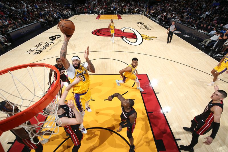 MIAMI, FL - DECEMBER 4:  Anthony Davis #3 of the Los Angeles Lakers drives to the basket during the game against the Miami Heat on December 4, 2024 at Kaseya Center in Miami, Florida. NOTE TO USER: User expressly acknowledges and agrees that, by downloading and or using this Photograph, user is consenting to the terms and conditions of the Getty Images License Agreement. Mandatory Copyright Notice: Copyright 2024 NBAE (Photo by Joe Murphy/NBAE via Getty Images)