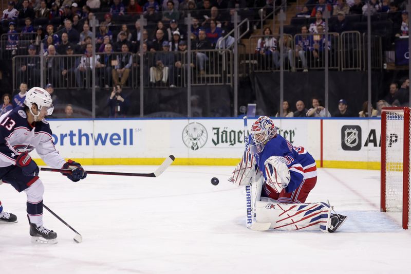 Feb 28, 2024; New York, New York, USA; Columbus Blue Jackets left wing Johnny Gaudreau (13) takes a shot against New York Rangers goaltender Igor Shesterkin (31) during the first period at Madison Square Garden. Mandatory Credit: Brad Penner-USA TODAY Sports