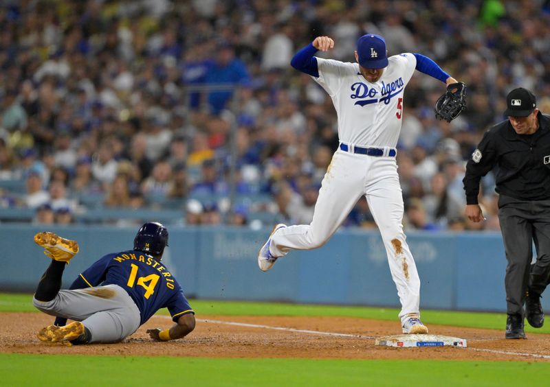 Aug 16, 2023; Los Angeles, California, USA;  Los Angeles Dodgers first baseman Freddie Freeman (5) beats Milwaukee Brewers second baseman Andruw Monasterio (14) back to first for a double play in the fourth inning at Dodger Stadium. Mandatory Credit: Jayne Kamin-Oncea-USA TODAY Sports