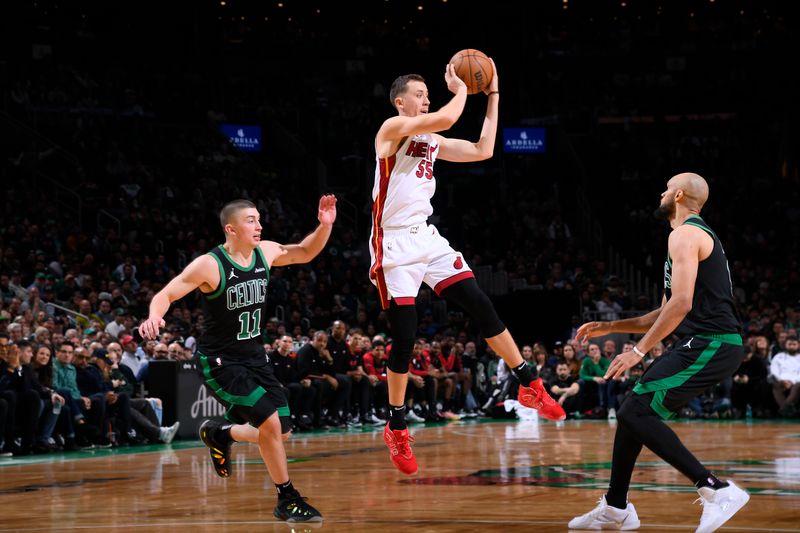 BOSTON, MA - DECEMBER 2: Duncan Robinson #55 of the Miami Heat passes the ball during the game against the Boston Celtics on December 2, 2024 at TD Garden in Boston, Massachusetts. NOTE TO USER: User expressly acknowledges and agrees that, by downloading and/or using this Photograph, user is consenting to the terms and conditions of the Getty Images License Agreement. Mandatory Copyright Notice: Copyright 2024 NBAE (Photo by Brian Babineau/NBAE via Getty Images)