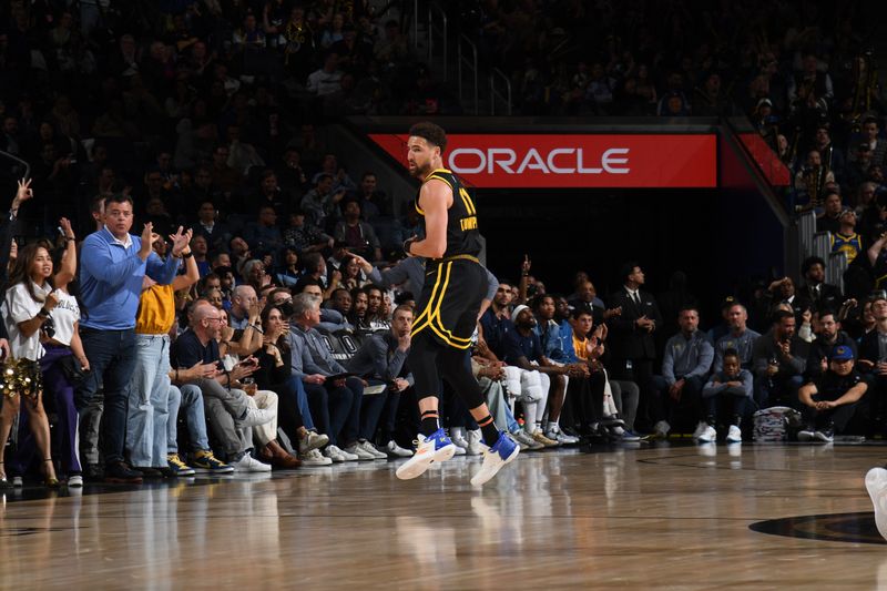 SAN FRANCISCO, CA - MARCH 20: Klay Thompson #11 of the Golden State Warriors celebrates during the game against the Memphis Grizzlies on March 20, 2024 at Chase Center in San Francisco, California. NOTE TO USER: User expressly acknowledges and agrees that, by downloading and or using this photograph, user is consenting to the terms and conditions of Getty Images License Agreement. Mandatory Copyright Notice: Copyright 2024 NBAE (Photo by Noah Graham/NBAE via Getty Images)