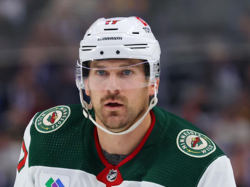 Nov 10, 2023; Buffalo, New York, USA;  Minnesota Wild left wing Marcus Foligno (17) looks for the puck during the first period against the Buffalo Sabres at KeyBank Center. Mandatory Credit: Timothy T. Ludwig-USA TODAY Sports