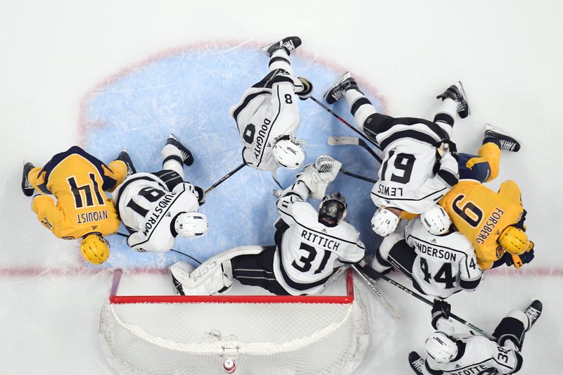 Jan 31, 2024; Nashville, Tennessee, USA; Los Angeles Kings goaltender David Rittich (31) makes a save in traffic during the second period against the Nashville Predators at Bridgestone Arena. Mandatory Credit: Christopher Hanewinckel-USA TODAY Sports