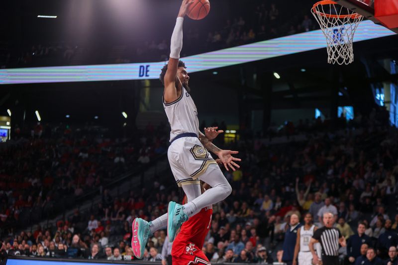 Feb 25, 2023; Atlanta, Georgia, USA; Georgia Tech Yellow Jackets forward Javon Franklin (4) dunks against the Louisville Cardinals in the second half at McCamish Pavilion. Mandatory Credit: Brett Davis-USA TODAY Sports