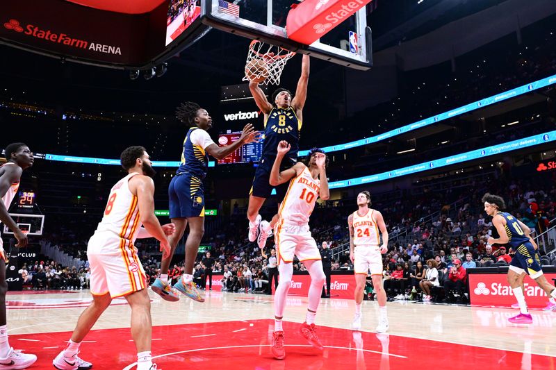 ATLANTA, GA - OCTOBER 8: Enrique Freeman #8 of the Indiana Pacers drives to the basket during the game against the Atlanta Hawks during a NBA preseason game on October 8, 2024 at State Farm Arena in Atlanta, Georgia.  NOTE TO USER: User expressly acknowledges and agrees that, by downloading and/or using this Photograph, user is consenting to the terms and conditions of the Getty Images License Agreement. Mandatory Copyright Notice: Copyright 2024 NBAE (Photo by Adam Hagy/NBAE via Getty Images)