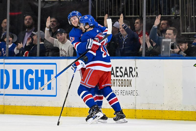 Apr 13, 2024; New York, New York, USA;  New York Rangers left wing Artemi Panarin (10) celebrates his goal against the New York Islanders with New York Rangers defenseman Adam Fox (23) during the third period at Madison Square Garden. Mandatory Credit: Dennis Schneidler-USA TODAY Sports