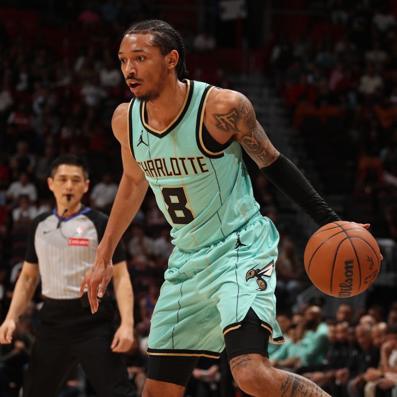 MIAMI, FL - March 23:  Nick Smith Jr. #8 of the Charlotte Hornets dribbles the ball during the game against the Miami Heat on March 23, 2025 at Kaseya Center in Miami, Florida. NOTE TO USER: User expressly acknowledges and agrees that, by downloading and or using this Photograph, user is consenting to the terms and conditions of the Getty Images License Agreement. Mandatory Copyright Notice: Copyright 2025 NBAE (Photo by Issac Baldizon/NBAE via Getty Images)