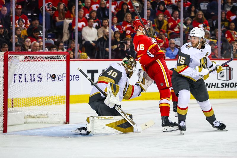 Dec 20, 2025; Calgary, Alberta, CAN; Vegas Golden Knights defenseman Noah Hanifin (15) and Calgary Flames left wing Joel Farabee (86) fight for position in front of Vegas Golden Knights goaltender Akira Schmid (40) during the second period at Scotiabank Saddledome. Mandatory Credit: Sergei Belski-Imagn Images