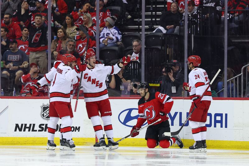 Apr 27, 2025; Newark, New Jersey, USA; Carolina Hurricanes right wing Andrei Svechnikov (37) celebrates his goal against the New Jersey Devils during the second period in game four of the first round of the 2025 Stanley Cup Playoffs at Prudential Center. Mandatory Credit: Ed Mulholland-Imagn Images