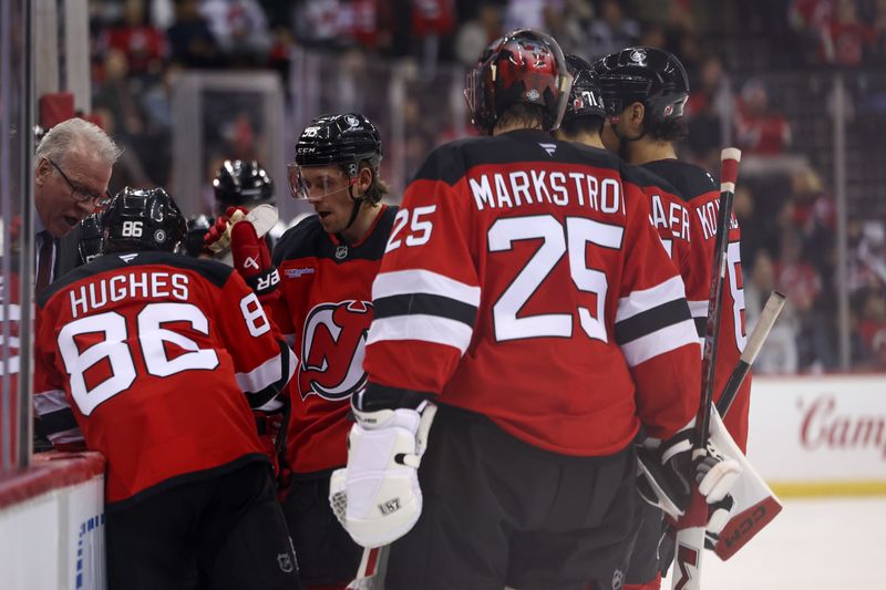 Dec 6, 2024; Newark, New Jersey, USA; New Jersey Devils assistant coach Ryan McGill talks to the team during the third period of their game against the Seattle Kraken at Prudential Center. Mandatory Credit: Ed Mulholland-Imagn Images