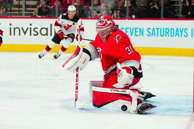 May 11, 2023; Raleigh, North Carolina, USA; Carolina Hurricanes goaltender Frederik Andersen (31) makes a save against the New Jersey Devils during the second period in game five of the second round of the 2023 Stanley Cup Playoffs at PNC Arena. Mandatory Credit: James Guillory-USA TODAY Sports