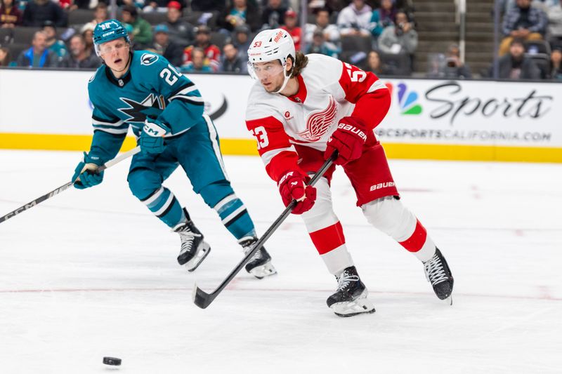 Nov 18, 2024; San Jose, California, USA; Detroit Red Wings defenseman Moritz Seider (53) chases the puck during the third period against the San Jose Sharks at SAP Center at San Jose. Mandatory Credit: Bob Kupbens-Imagn Images