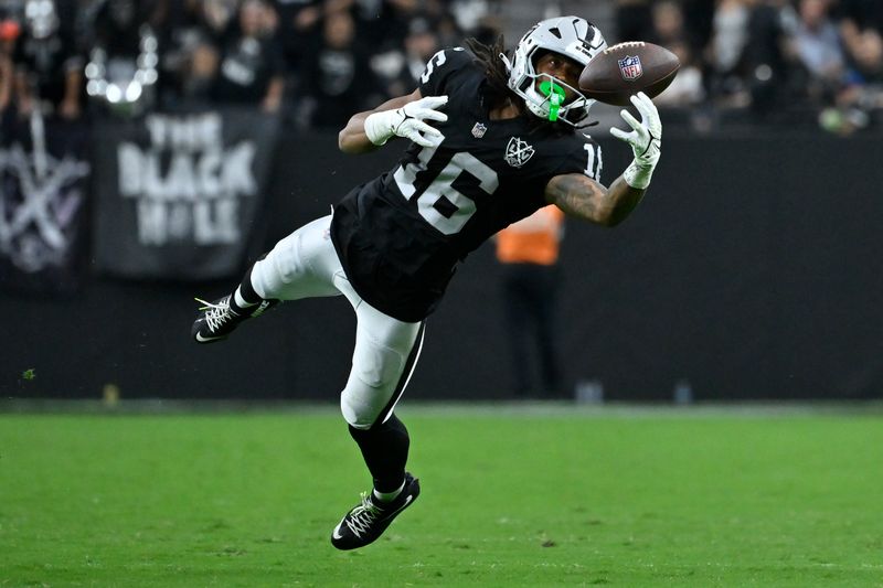 Las Vegas Raiders wide receiver Jakobi Meyers can't haul in a pass during the second half of an NFL football game against the Cleveland Browns Sunday, Sept. 29, 2024, in Las Vegas. (AP Photo/David Becker)