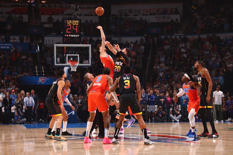 OKLAHOMA CITY, OK - MARCH 29: Jusuf Nurkic #20 of the Phoenix Suns goes for the tipoff against Chet Holmgren #7 of the Oklahoma City Thunder during the game on March 29, 2024 at Paycom Arena in Oklahoma City, Oklahoma. NOTE TO USER: User expressly acknowledges and agrees that, by downloading and or using this photograph, User is consenting to the terms and conditions of the Getty Images License Agreement. Mandatory Copyright Notice: Copyright 2024 NBAE (Photo by Zach Beeker/NBAE via Getty Images)