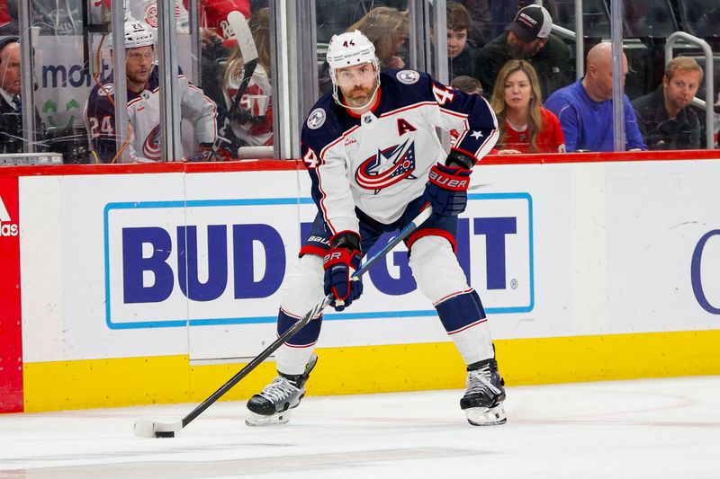 Mar 19, 2024; Detroit, Michigan, USA; Columbus Blue Jackets defenseman Erik Gudbranson (44) handles the puck during the first period of the game against the Detroit Red Wings at Little Caesars Arena. Mandatory Credit: Brian Bradshaw Sevald-USA TODAY Sports