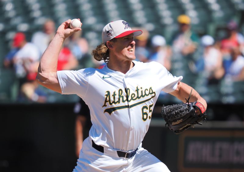 Jul 4, 2024; Oakland, California, USA; Oakland Athletics relief pitcher Tyler Ferguson (65) pitches the ball against the Los Angeles Angels during the ninth inning at Oakland-Alameda County Coliseum. Mandatory Credit: Kelley L Cox-USA TODAY Sports