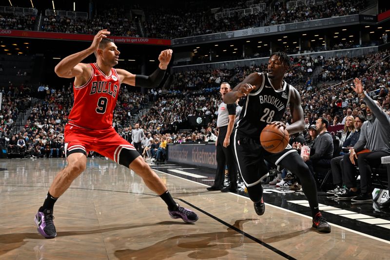 BROOKLYN, NY - NOVEMBER 9: Dorian Finney-Smith #28 of the Brooklyn Nets dribbles the ball during the game against the Chicago Bulls on November 9, 2024 at Barclays Center in Brooklyn, New York. NOTE TO USER: User expressly acknowledges and agrees that, by downloading and or using this Photograph, user is consenting to the terms and conditions of the Getty Images License Agreement. Mandatory Copyright Notice: Copyright 2024 NBAE (Photo by David Dow/NBAE via Getty Images)